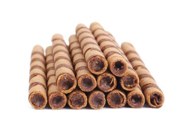 Heap of tasty wafer rolls isolated on white background