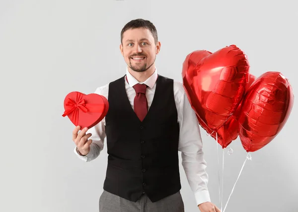 Handsome Man Heart Shaped Balloons Gift Light Background Valentine Day — Stock Photo, Image