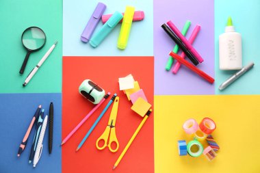Composition with different colorful stationery on color background