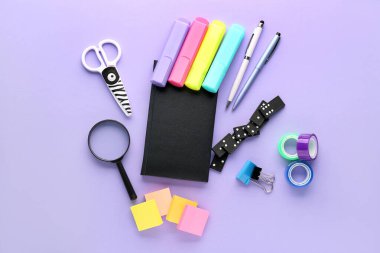 Set of stationery on lilac background