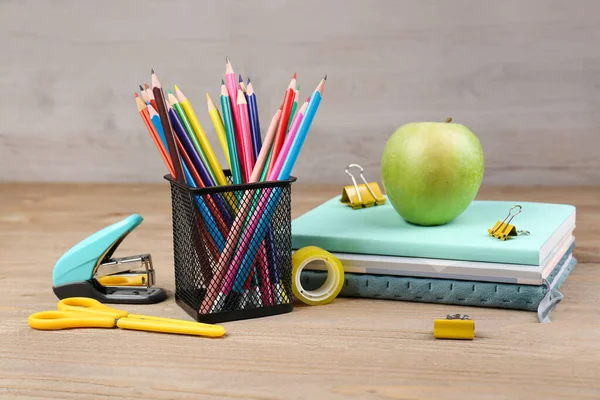 Pencils Holder Notebooks Green Apple Stapler Scissors Wooden Background — Zdjęcie stockowe