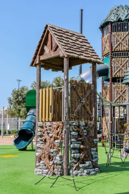 View of children's complex with climbing net on playground