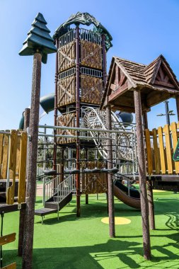 View of children's complex with bridge on playground