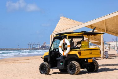 Lifeguard car with ring buoy at sea resort