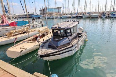 Modern yachts in sea at pier