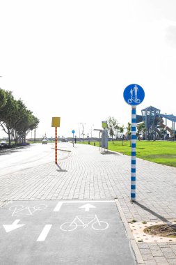 View of road with bicycle signs and pavement