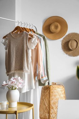 Rack with clothes in modern atelier