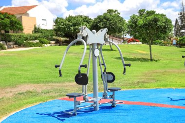 Modern exercise equipment on sport ground in city