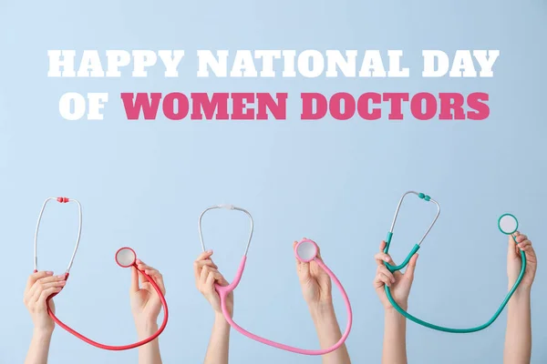 stock image Greeting card for National Day of Women Doctors with many hands holding stethoscopes on light blue background