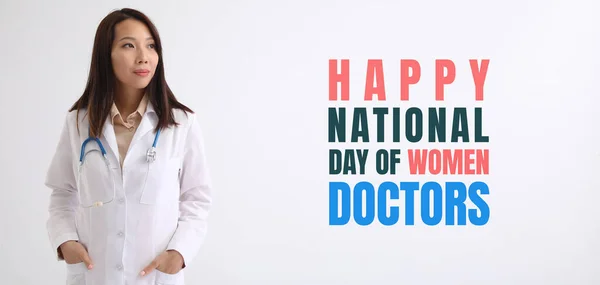 Asian doctor on light background. National Day of Women Doctors