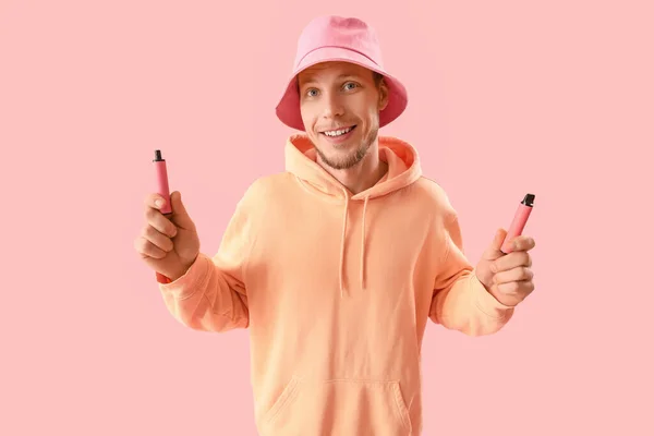 Young Man Bucket Hat Disposable Electronic Cigarettes Pink Background — Stock Photo, Image