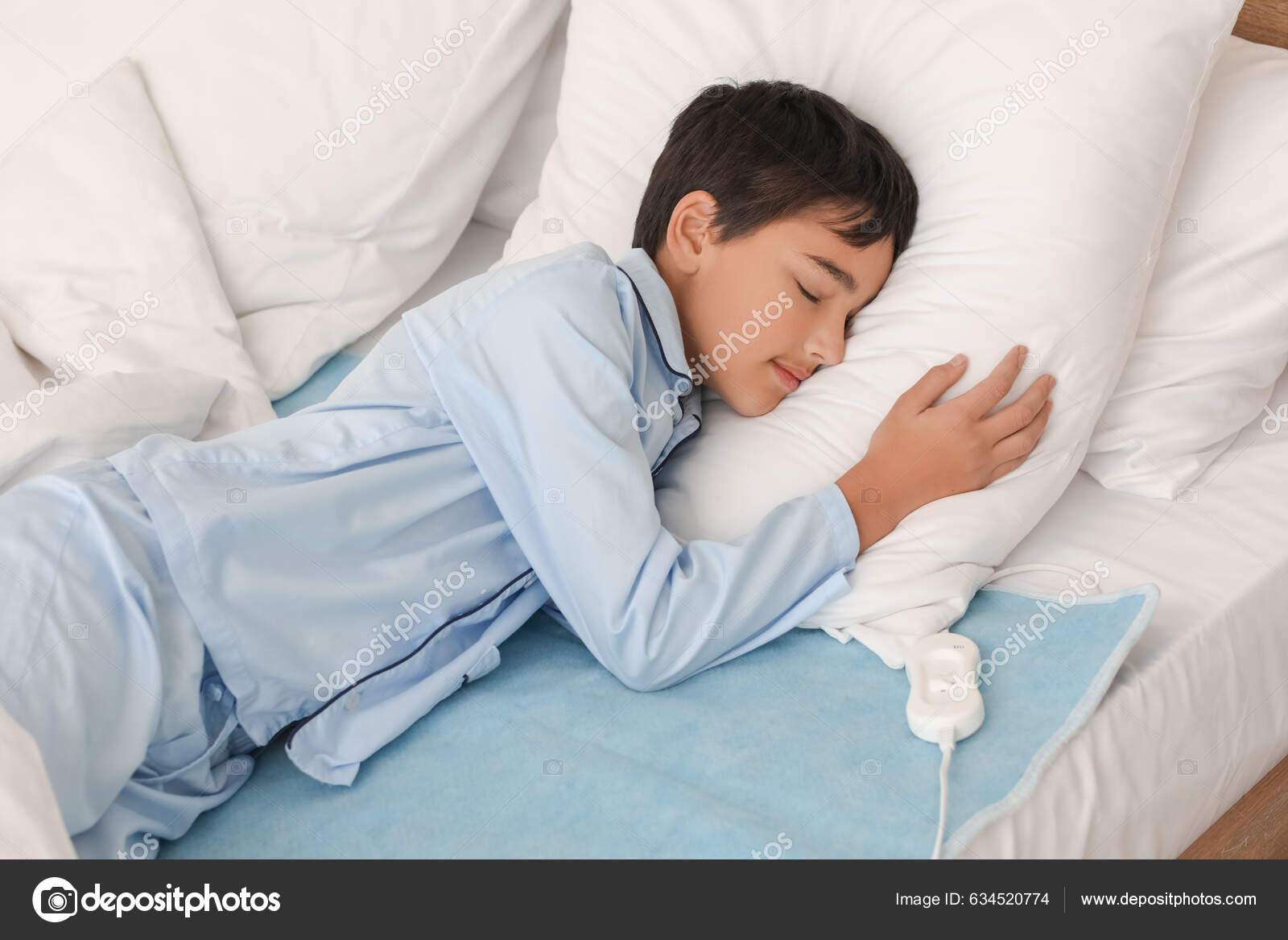 Little Boy Sleeping Electric Heating Pad Bedroom Stock Photo by