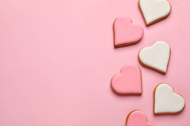 Different heart shaped cookies on pink background. Valentines Day celebration