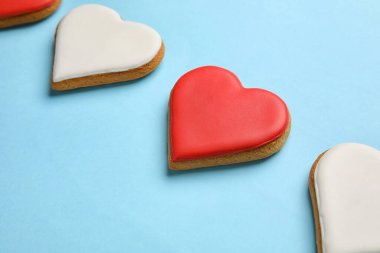Sweet heart shaped cookies on color background, closeup. Valentines Day celebration