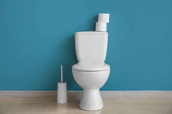 Ceramic Toilet Bowl Brush Paper Rolls Blue Wall — Stock Photo, Image