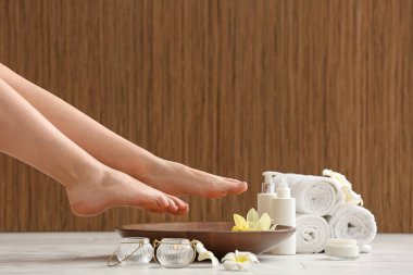 Woman undergoing spa pedicure treatment in salon, closeup