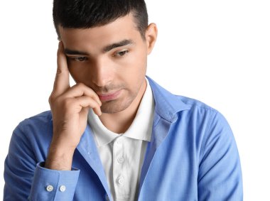 Thoughtful young man on white background, closeup