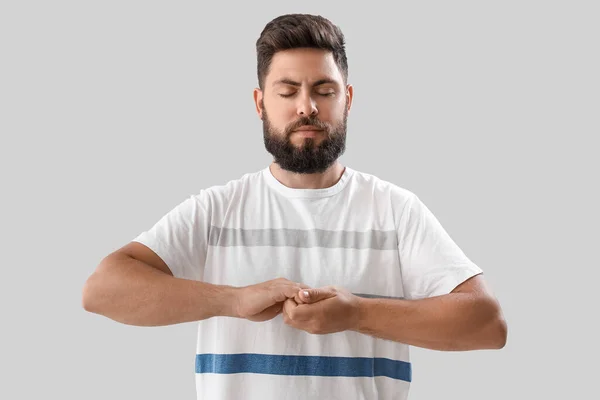 Handsome Young Man Meditating Light Background — Stock Photo, Image