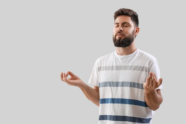 Handsome Young Man Meditating Light Background — Stock Photo, Image