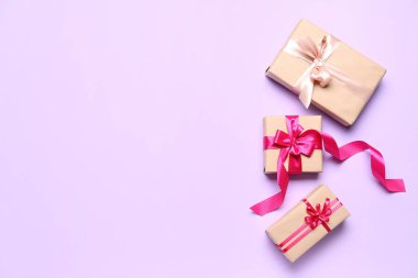 Beautiful gifts for Valentine's Day celebration on lilac background