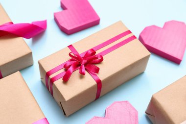 Beautiful gift boxes for Valentine's Day celebration on color background, closeup