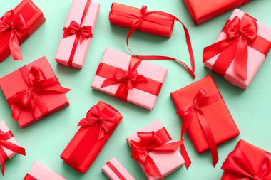 Set of different gifts for Valentine's Day celebration on color background