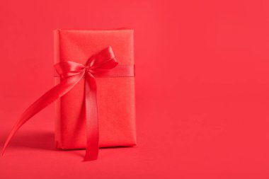 Gift box on red background. Valentine's Day celebration
