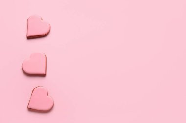 Sweet heart shaped cookies on pink background. Valentines Day celebration
