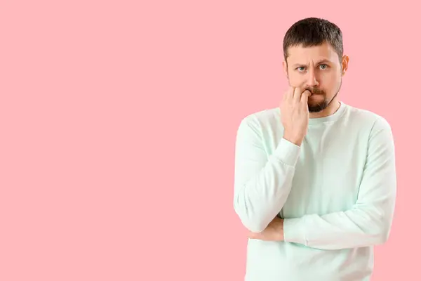 Handsome Man Biting Nails Pink Background — Stock Photo, Image