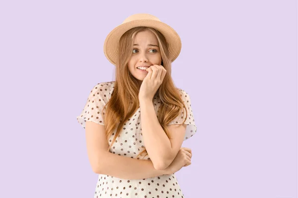 Young Woman Hat Biting Nails Lilac Background — Stock fotografie