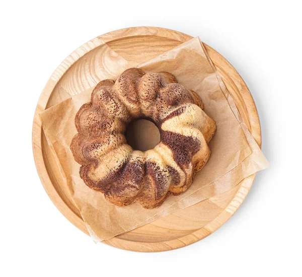 Wooden plate with delicious cake on white background