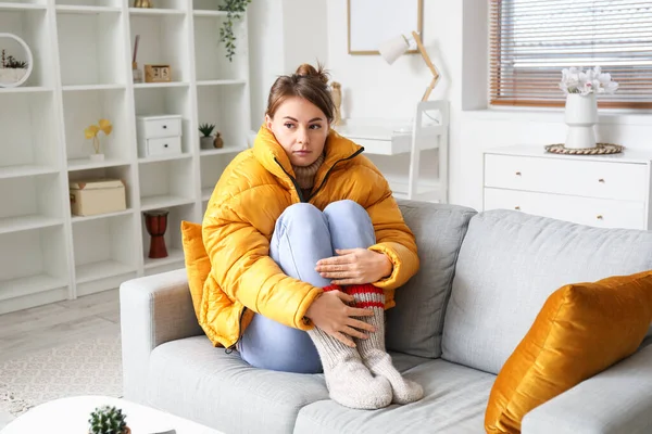 Frozen Young Woman Jacket Sitting Sofa Home — Stock Photo, Image