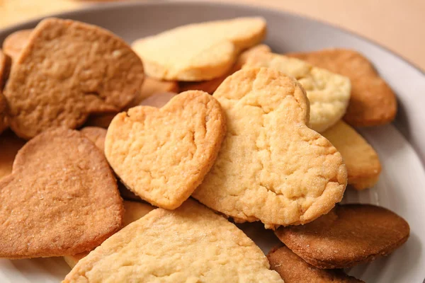 Plate with sweet heart shaped cookies, closeup. Valentines Day celebration