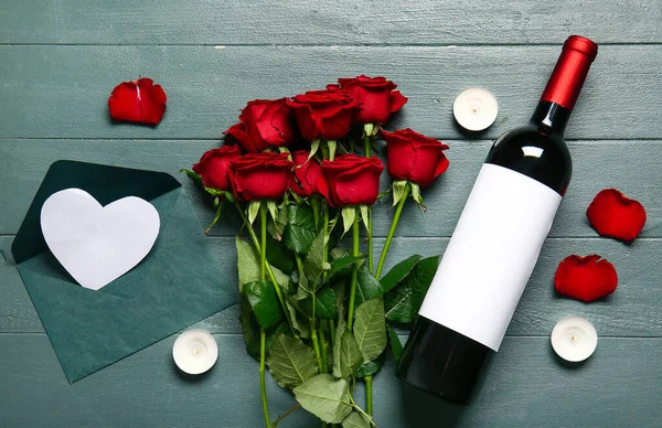 Bottle Wine Rose Flowers Burning Candles Envelope Green Wooden Background — Foto Stock