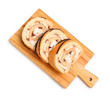 Cutting board with pieces of tasty sponge cake roll isolated on white background