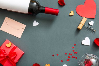 Frame made of wine, gift and decor on dark background. Valentines Day celebration