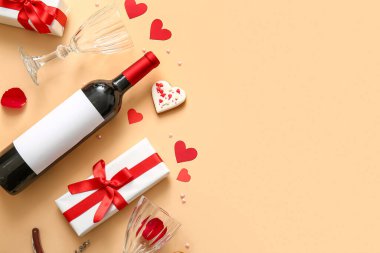 Composition with bottle of wine, glasses and gift box on color background. Valentines Day celebration