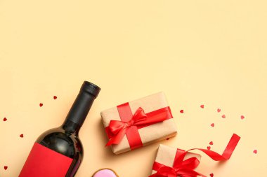 Composition with bottle of wine and gifts for Valentines Day celebration on color background