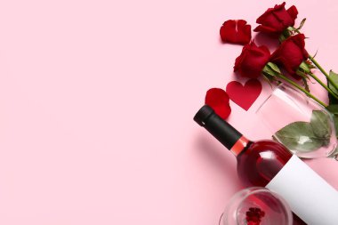 Bottle of wine, rose flowers, hearts and glass on pink background. Valentine's Day celebration