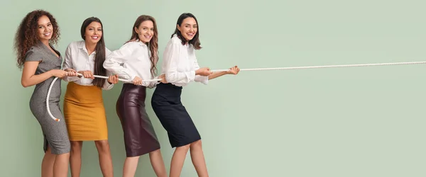 Young Women Pulling Rope Green Wall Concept Feminism — Stock Fotó
