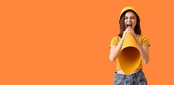 Protesting young woman with paper megaphone on orange background with space for text. Concept of feminism