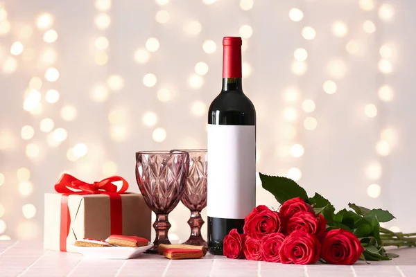 Bottle Wine Rose Flowers Glasses Gift Tile Table Blurred Lights — Stock Photo, Image