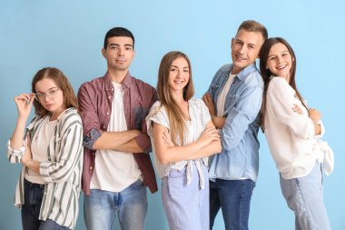 Group of happy friends on blue background