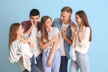 Group of happy friends on blue background