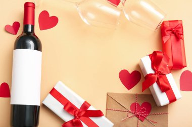Frame made of gifts for Valentines Day, wine and glasses on color background, closeup