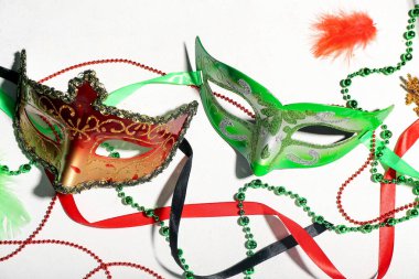 Carnival masks with beads on white background