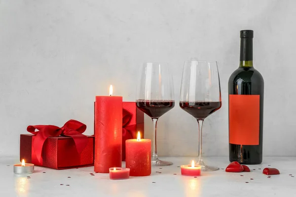 Burning Candles Glasses Wine Gift Boxes Light Background Valentine Day — Stockfoto