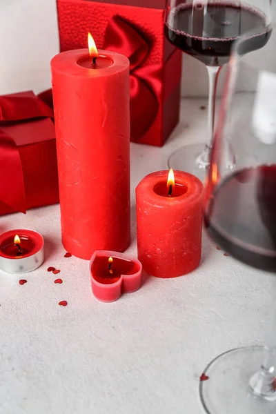 Burning Candles Glasses Wine Gift Boxes Light Background Closeup Valentine — Foto de Stock