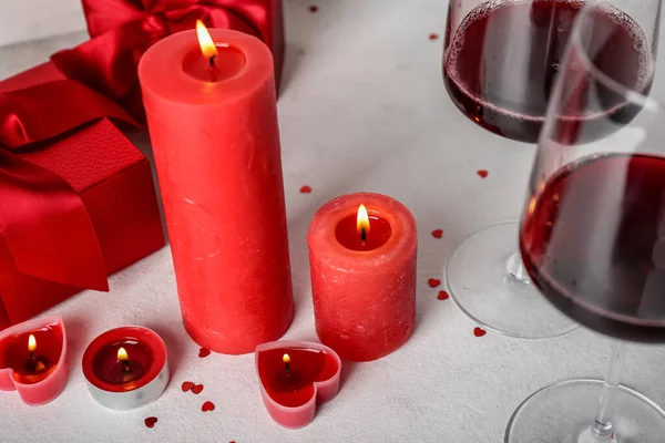 Burning Candles Glasses Wine Gift Boxes Light Background Valentine Day — Foto de Stock
