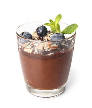 Glass of delicious chocolate pudding with blueberry, almond and mint isolated on white background